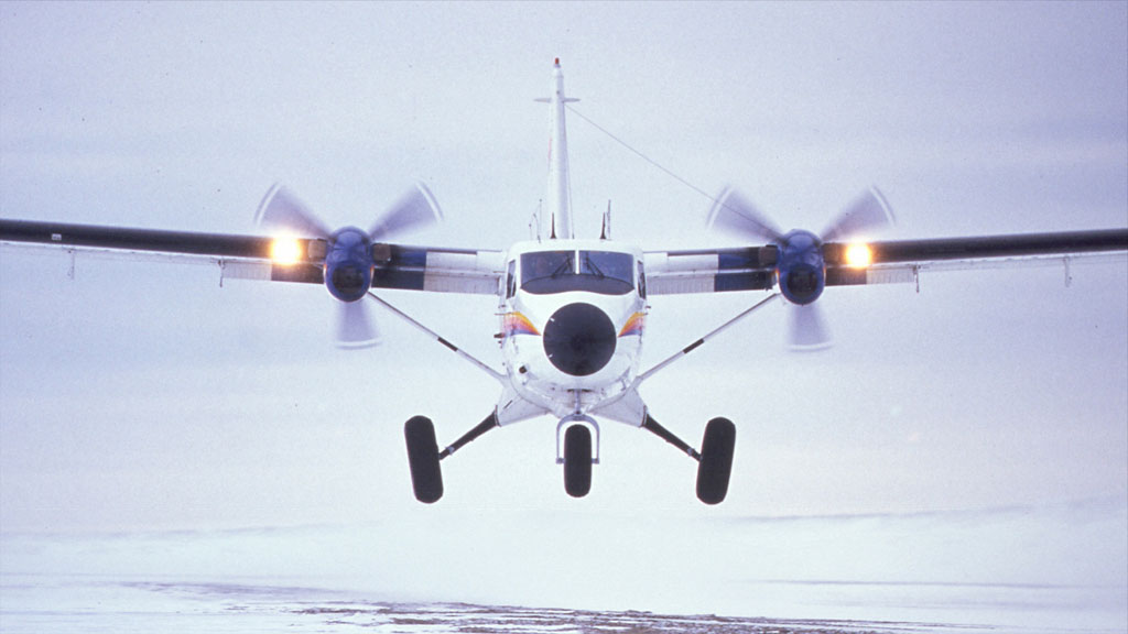  Twin Otter taking off from beach strip 